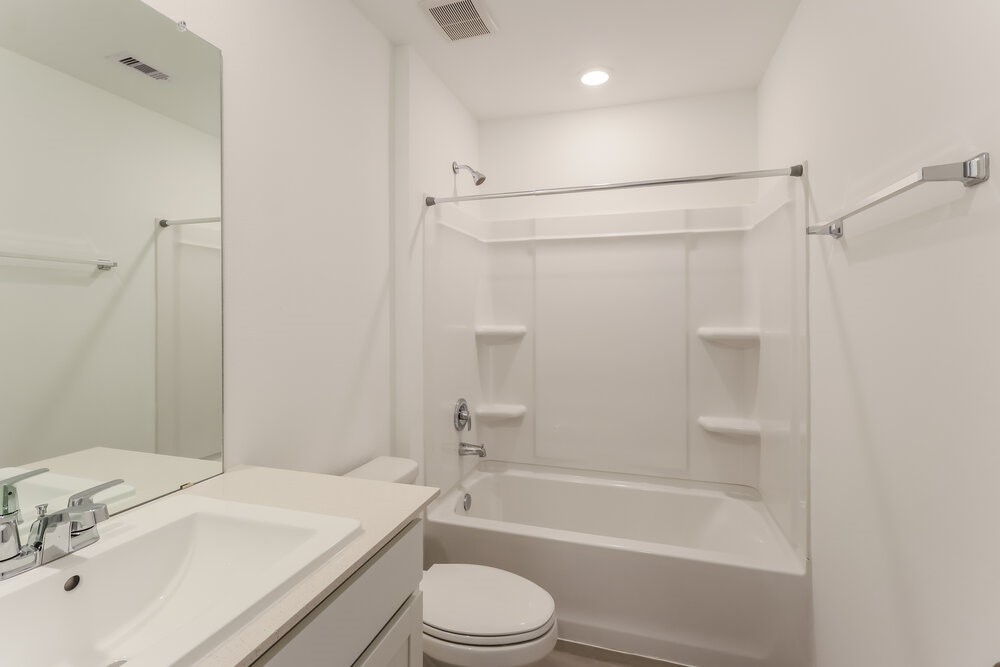 2084 Cedar Way Drive Conroe, TX 77301 - Photo 16 of 17 a bathroom with a sink toilet and shower