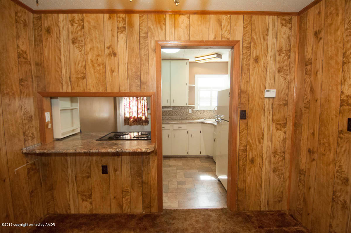 909 South Rusk Street Amarillo, TX 79102 - Photo 8 of 34 a view of granite countertop cabinets and outdoor view