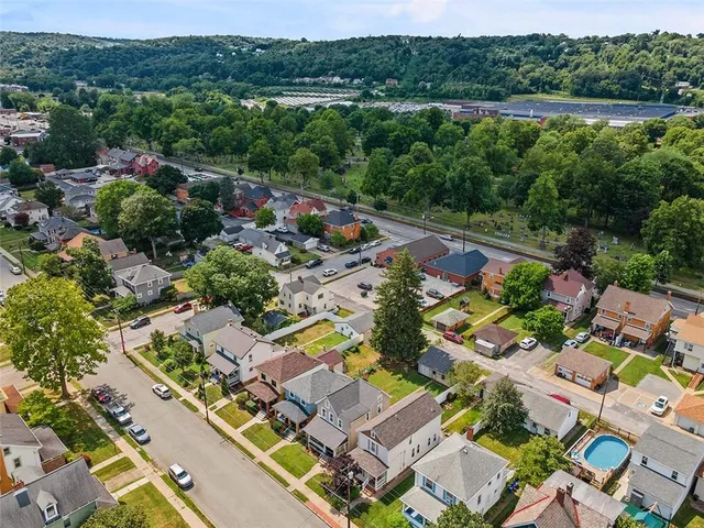 an aerial view of a house with a garden