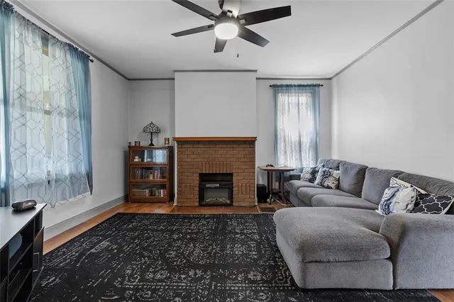 a living room with furniture and a fireplace
