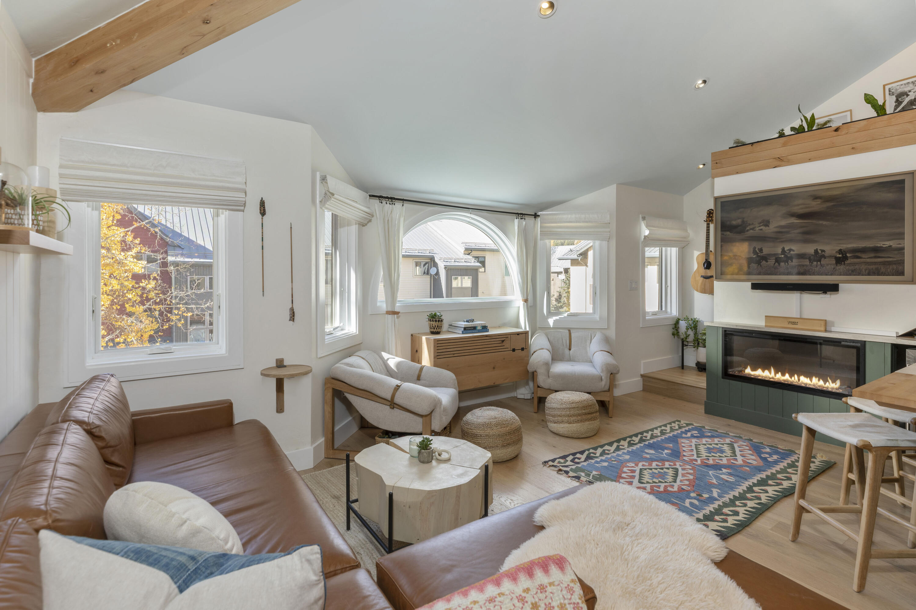 280 Mahoney Drive, Unit 6L Telluride, CO 81435 - Photo 1 of 28 a living room with furniture fireplace and flat screen tv
