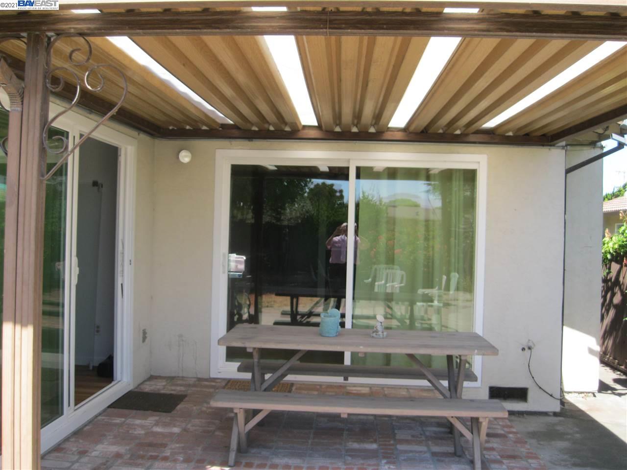 Washington Manor San Leandro, CA 94579 - Photo 16 of 18 a living room with a table and a large window