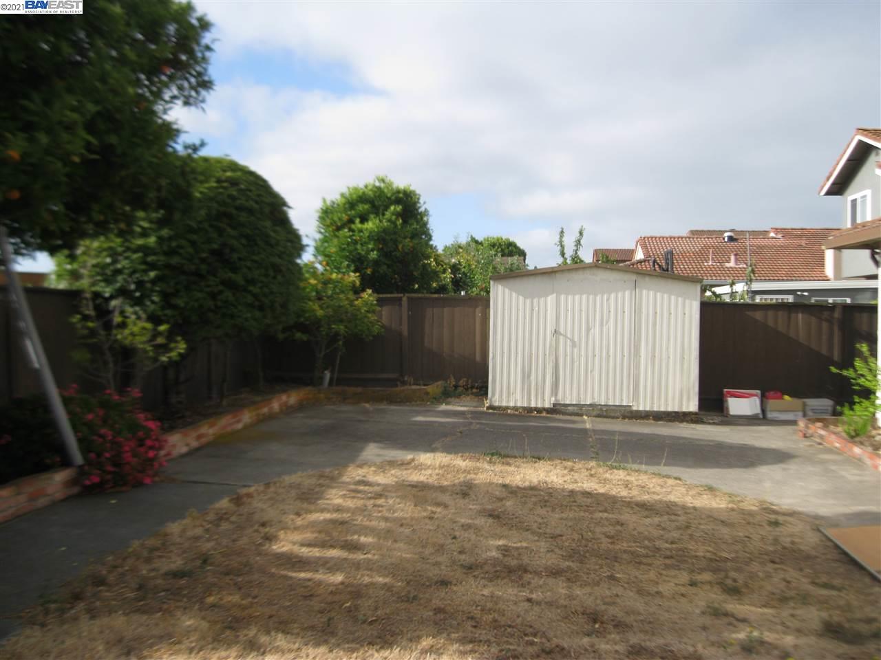 Washington Manor San Leandro, CA 94579 - Photo 17 of 18 a view of a house with backyard and trees