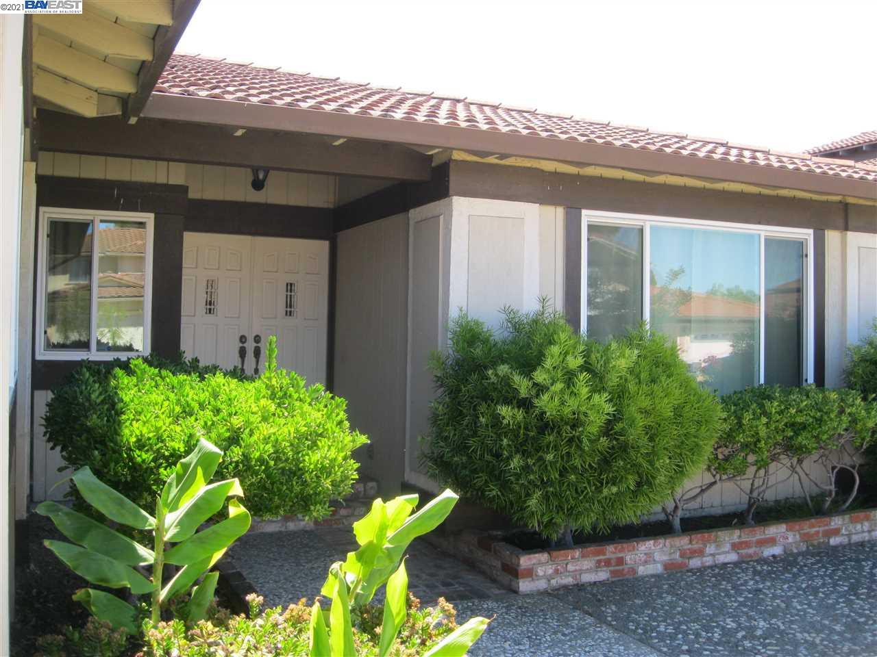 Washington Manor San Leandro, CA 94579 - Photo 3 of 18 a front view of a house with a garden