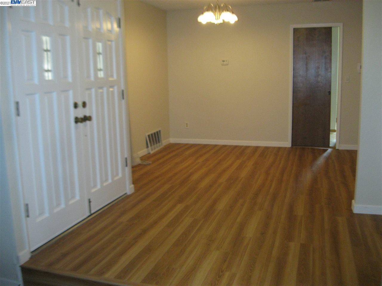Washington Manor San Leandro, CA 94579 - Photo 4 of 18 a view of a hallway with wooden floor