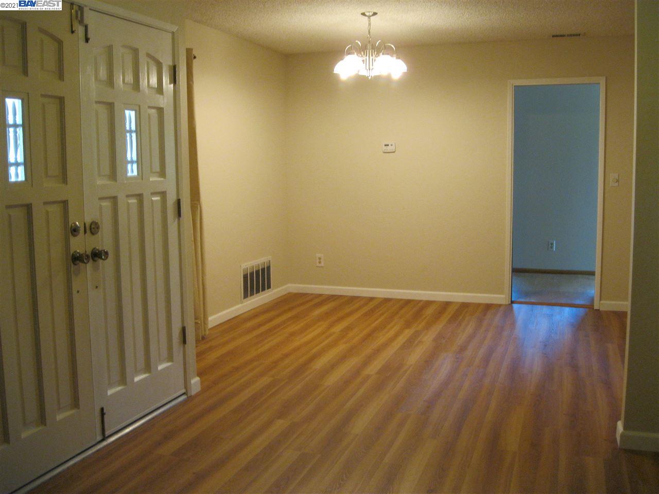 Washington Manor San Leandro, CA 94579 - Photo 5 of 18 an empty room with wooden floor