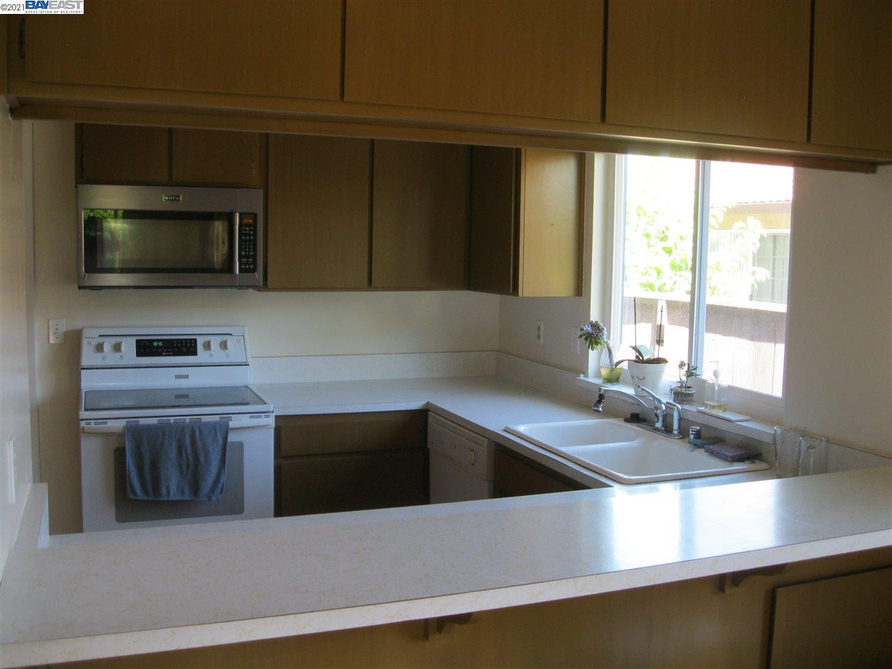 Washington Manor San Leandro, CA 94579 - Photo 7 of 18 a kitchen that has a sink and a stove top oven
