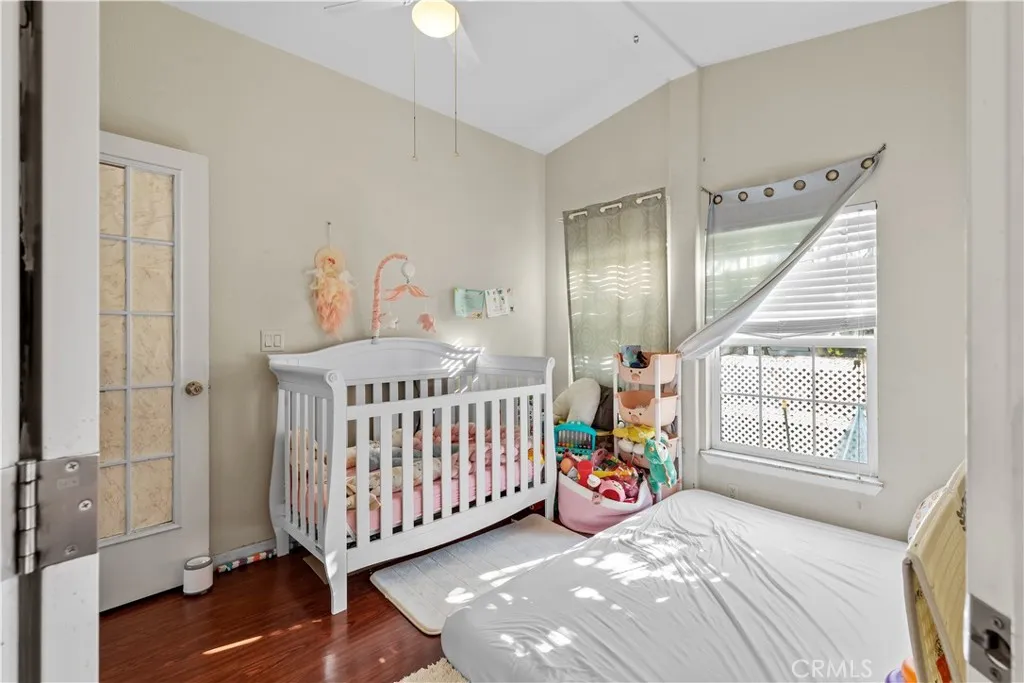 4801 West 1st Street Santa Ana, CA 92703 - Photo 13 of 19 a bedroom with a bed and a window