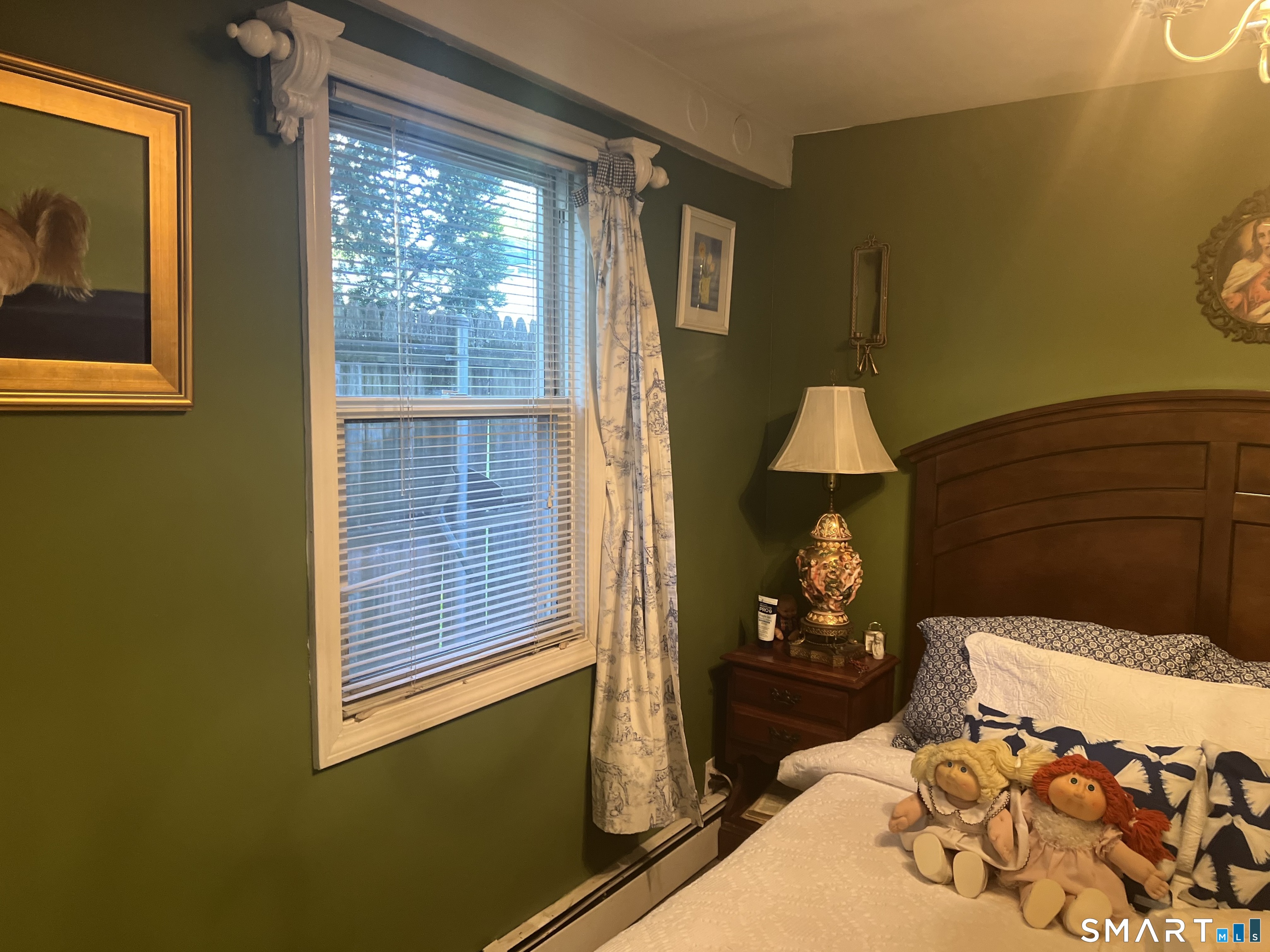 275 Long Ridge Road Stamford, CT 06905 - Photo 25 of 40 a bedroom with a bed and wooden floor