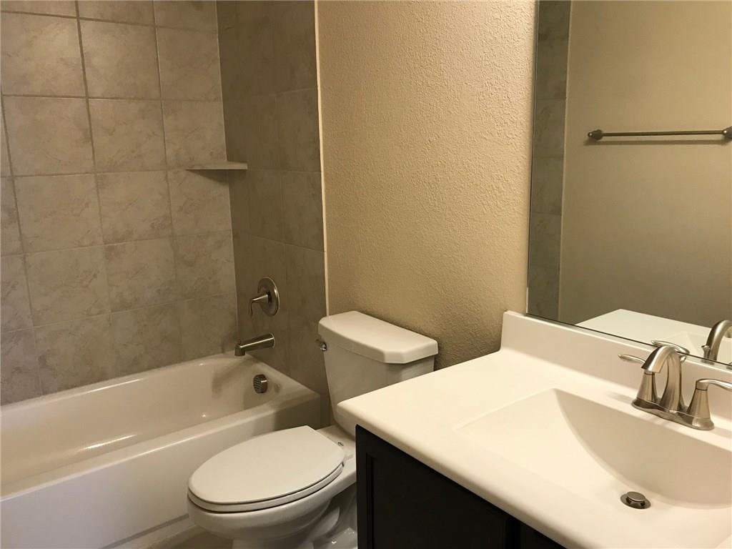 16009 Placid Trail Prosper, TX 75078 - Photo 16 of 18 a bathroom with a sink toilet and shower