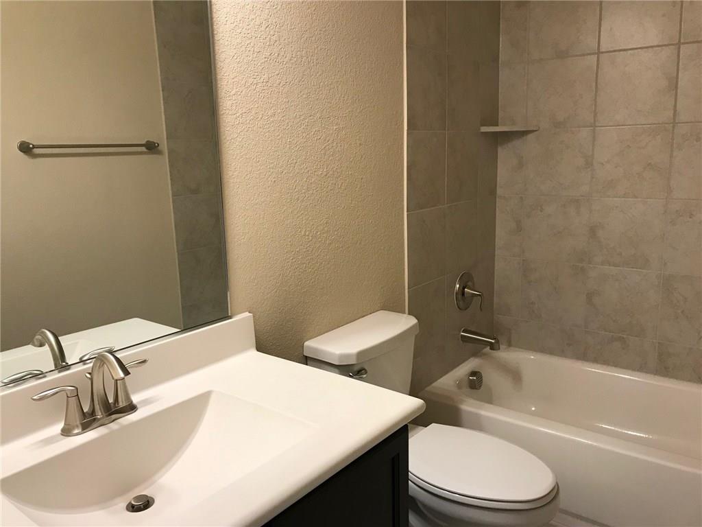 16009 Placid Trail Prosper, TX 75078 - Photo 2 of 18 a bathroom with a sink a toilet and shower