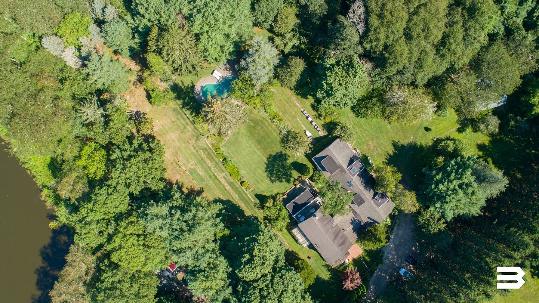 an aerial view of houses with yard