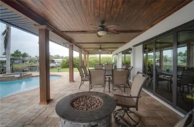 a view of a porch with furniture and wooden floor