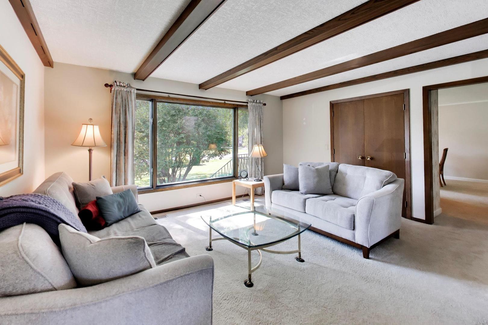 103 Cottonwood Road Northbrook, IL 60062 - Photo 3 of 50 a living room with furniture and a large window