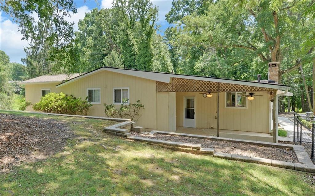 1858 Pinecrest Road Gainesville, GA 30501 - Photo 39 of 55 a backyard of a house with table and chairs