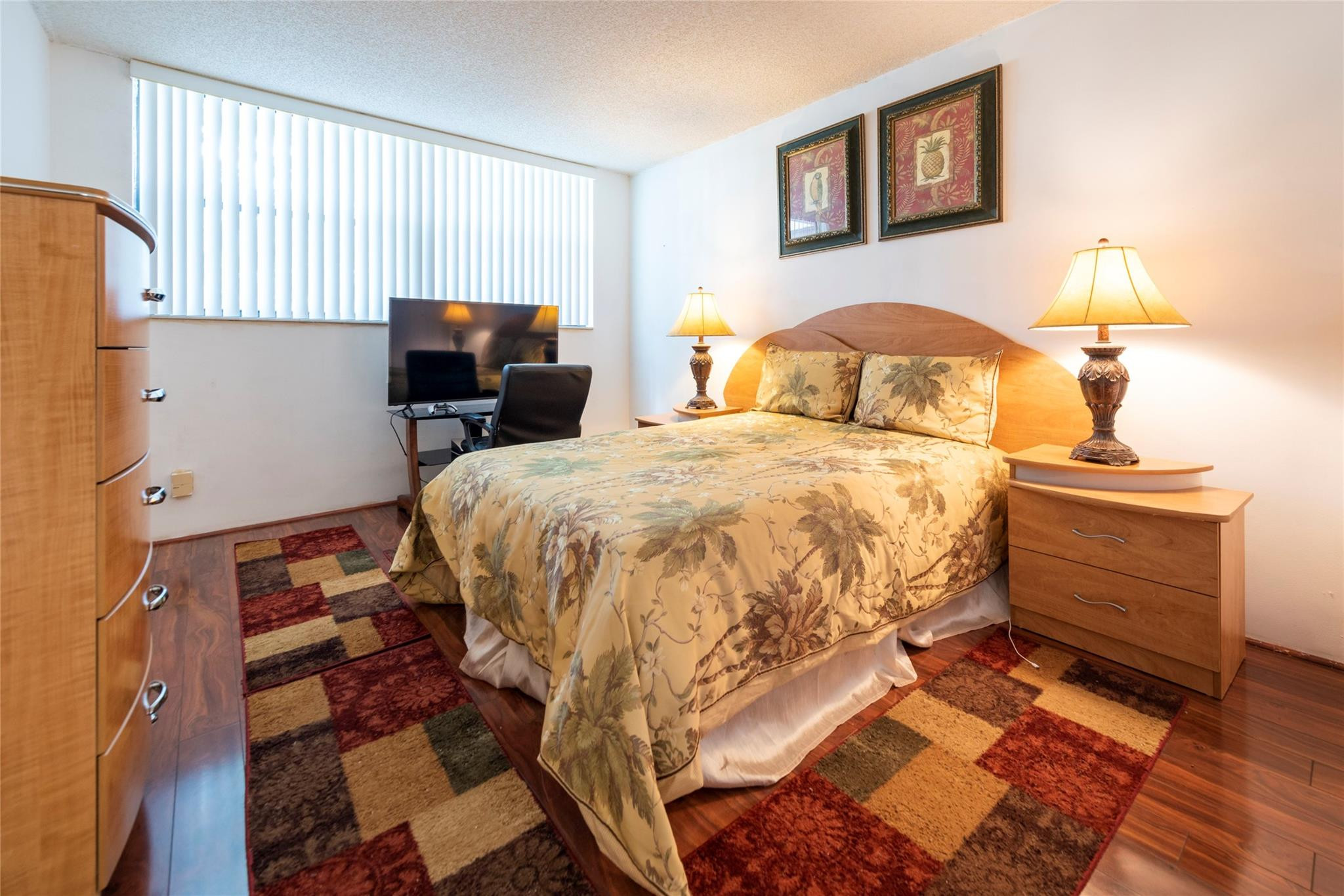 16325 Golf Club Road, Unit 210 Weston, FL 33326 - Photo 13 of 24 a bedroom with a bed and wooden floor