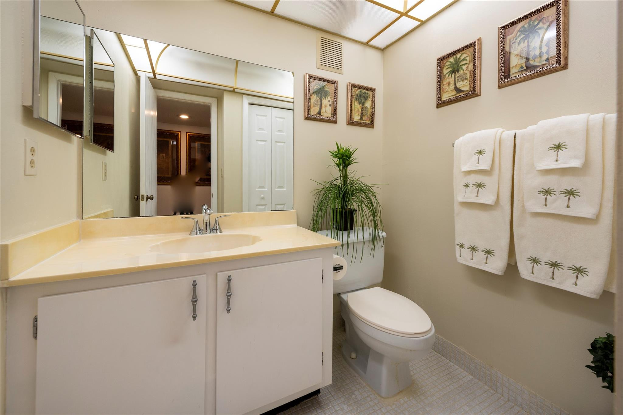 16325 Golf Club Road, Unit 210 Weston, FL 33326 - Photo 17 of 24 a bathroom with a granite countertop toilet sink and mirror