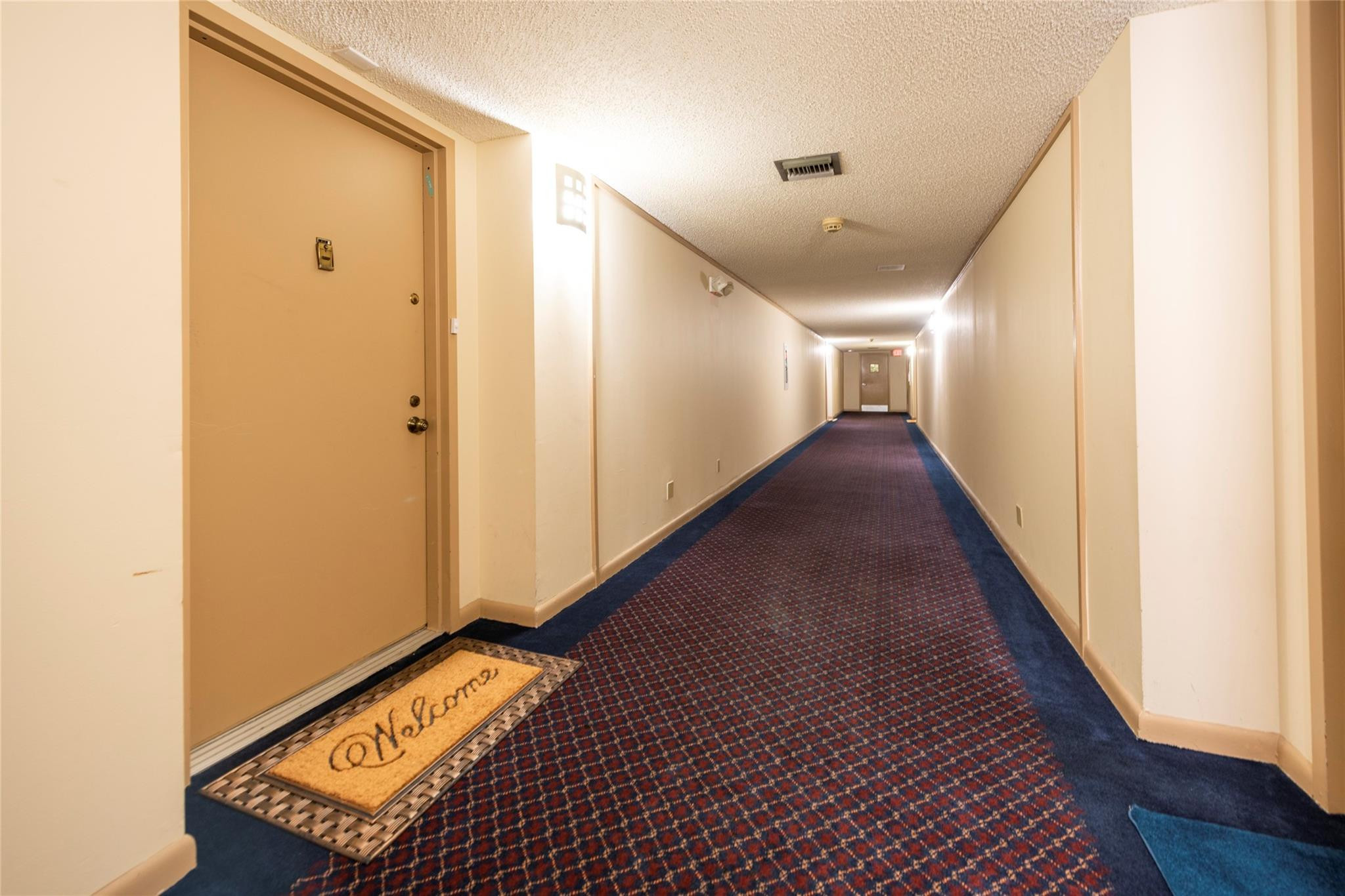 16325 Golf Club Road, Unit 210 Weston, FL 33326 - Photo 22 of 24 a view of a hallway with wooden floor