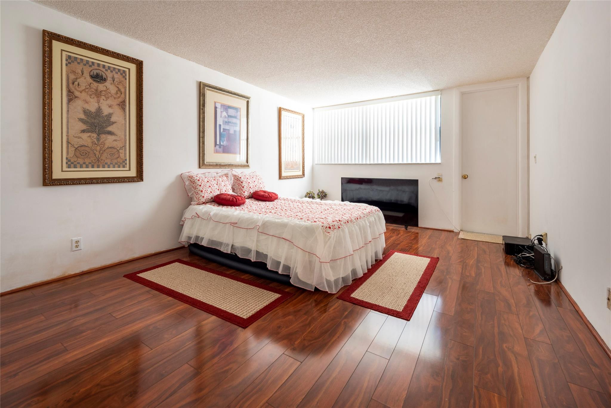16325 Golf Club Road, Unit 210 Weston, FL 33326 - Photo 10 of 24 a bedroom with a bed and a window
