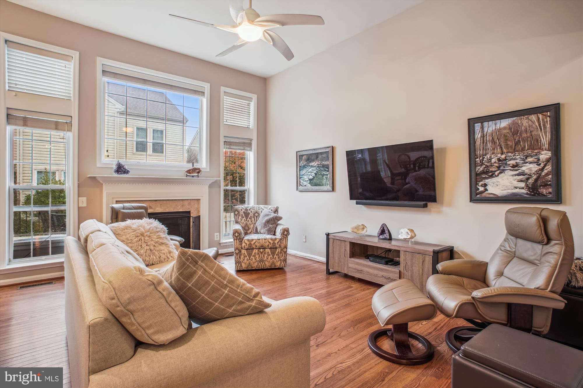 2454 Arctic Fox Way Reston, VA 20191 - Photo 13 of 54 a living room with furniture fireplace and a flat screen tv