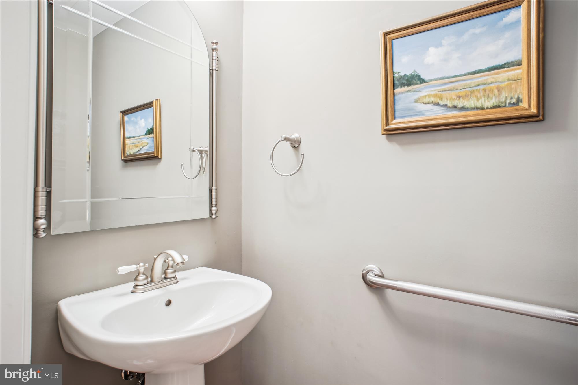 2454 Arctic Fox Way Reston, VA 20191 - Photo 18 of 54 a bathroom with a sink and a mirror