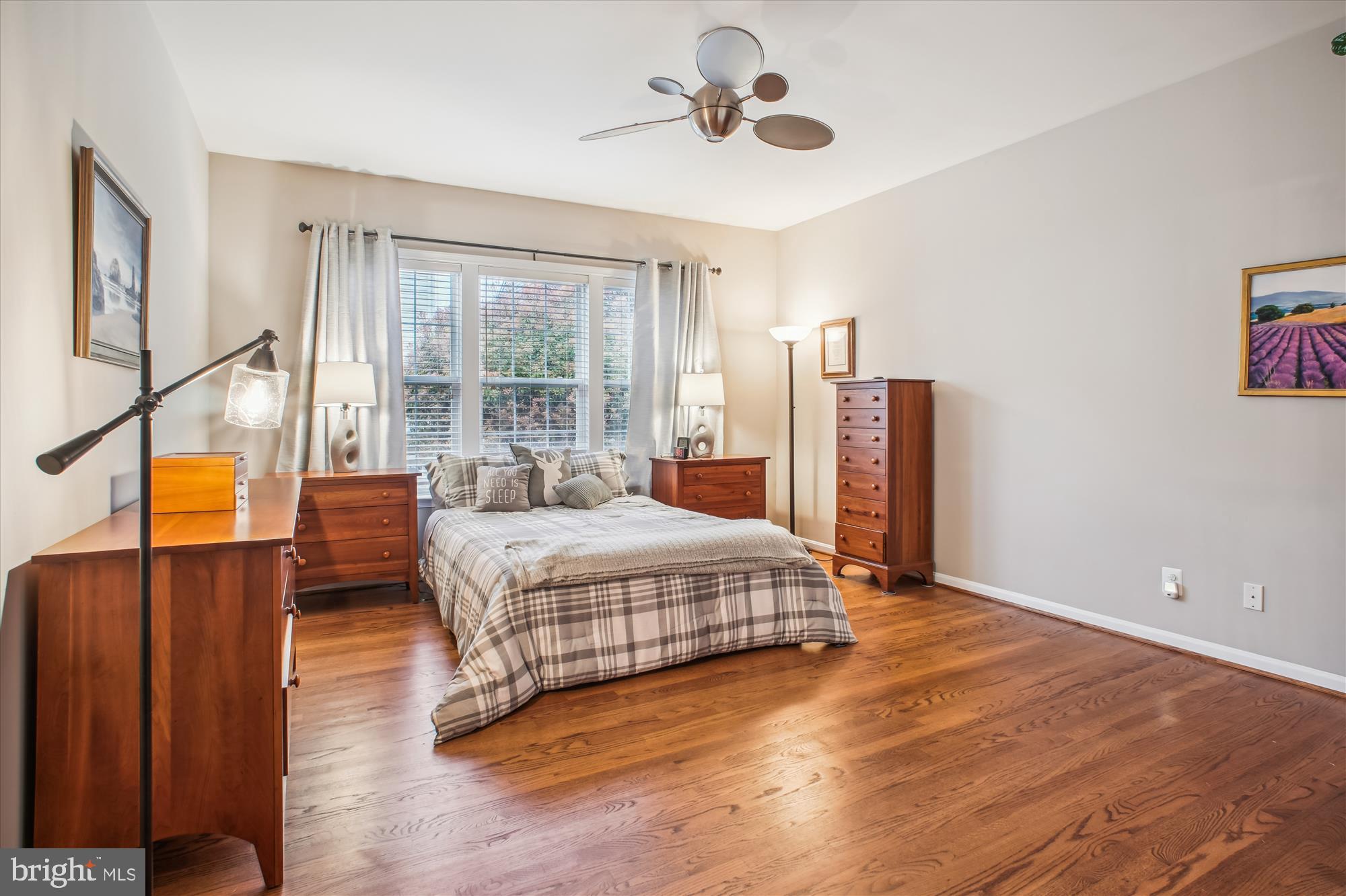 2454 Arctic Fox Way Reston, VA 20191 - Photo 19 of 54 a bedroom with a large bed and a chandelier