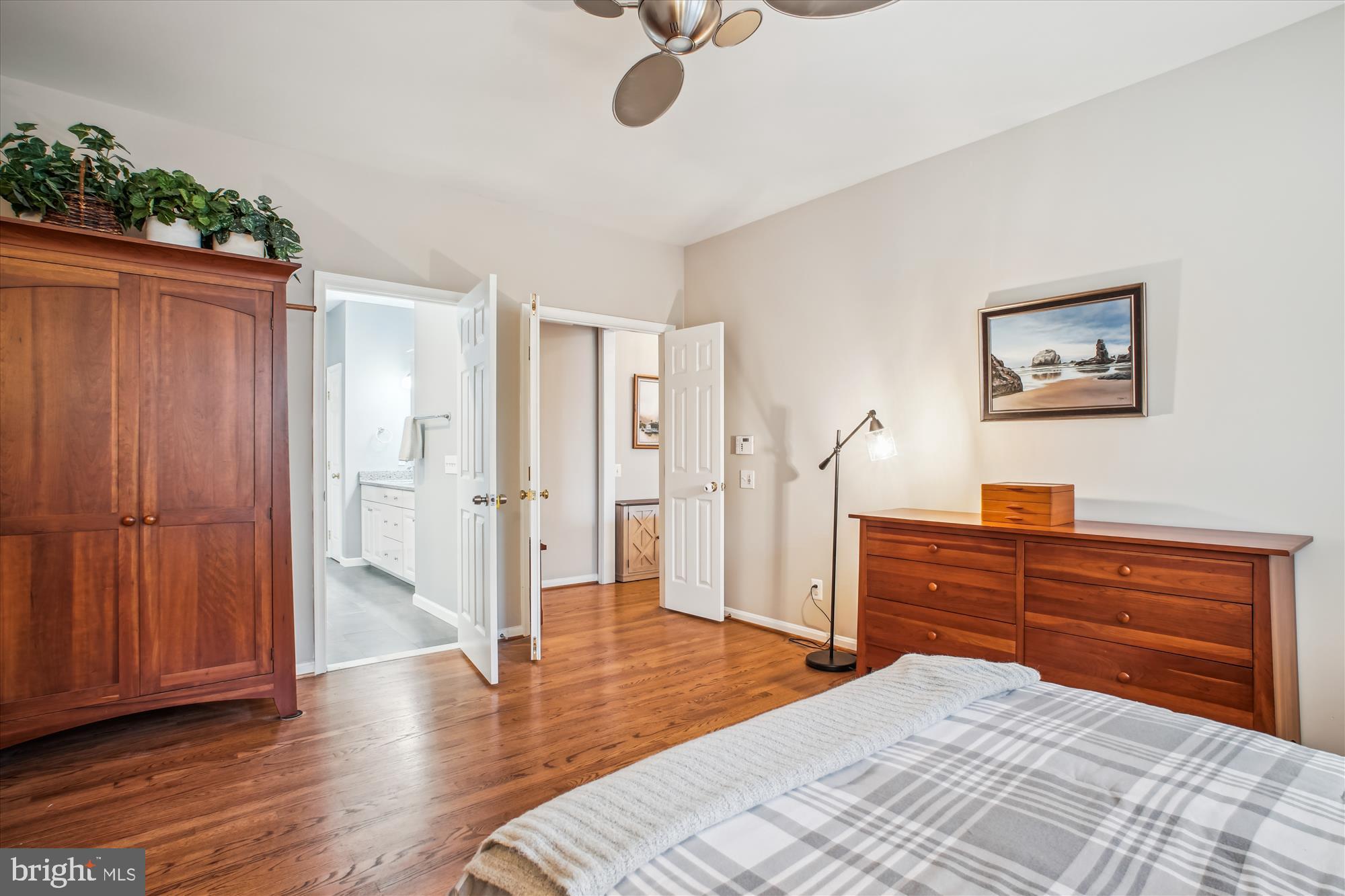 2454 Arctic Fox Way Reston, VA 20191 - Photo 21 of 54 a bedroom with a bed and a chandelier