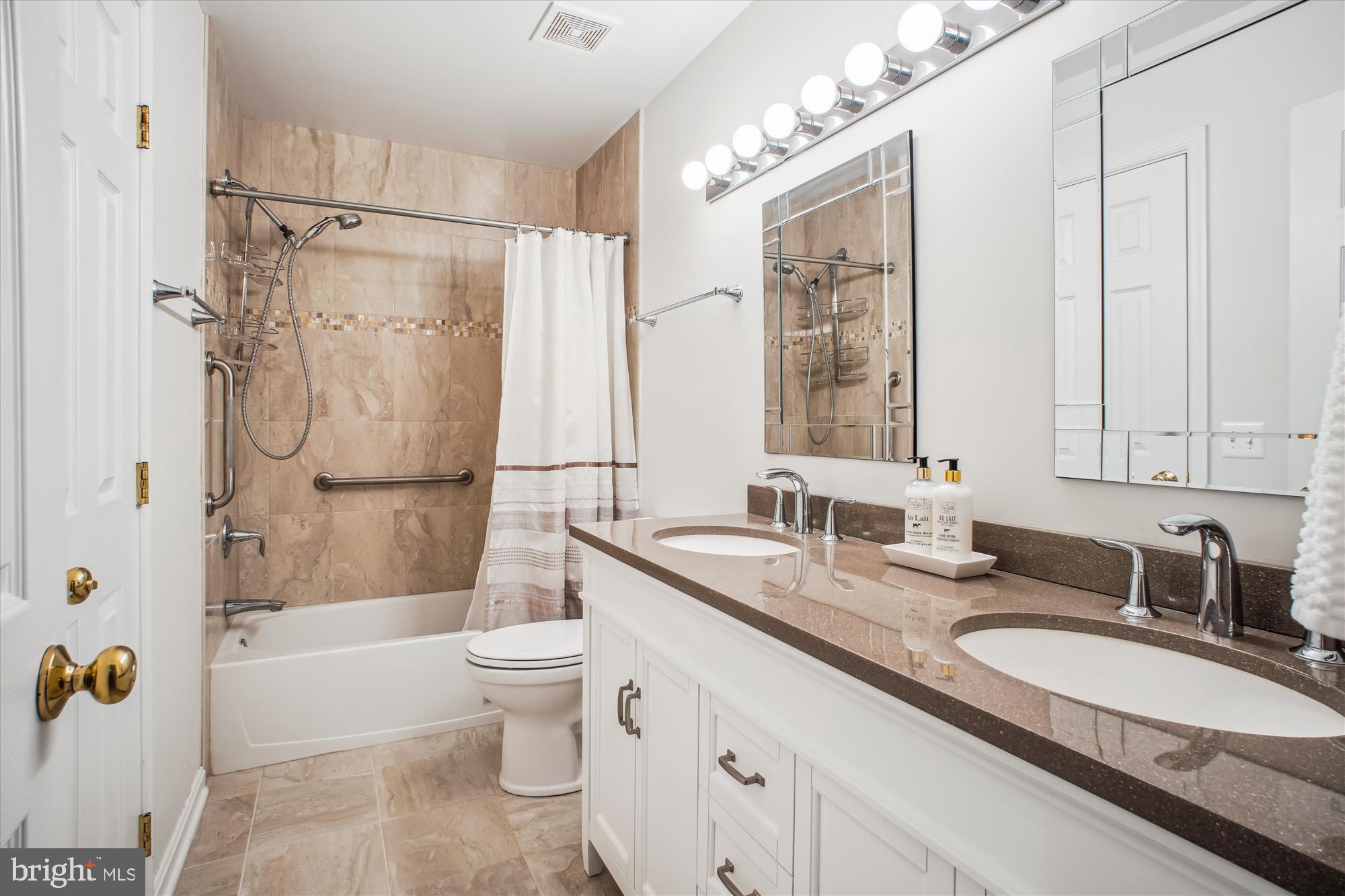 2454 Arctic Fox Way Reston, VA 20191 - Photo 30 of 54 a bathroom with a granite countertop sink toilet and shower