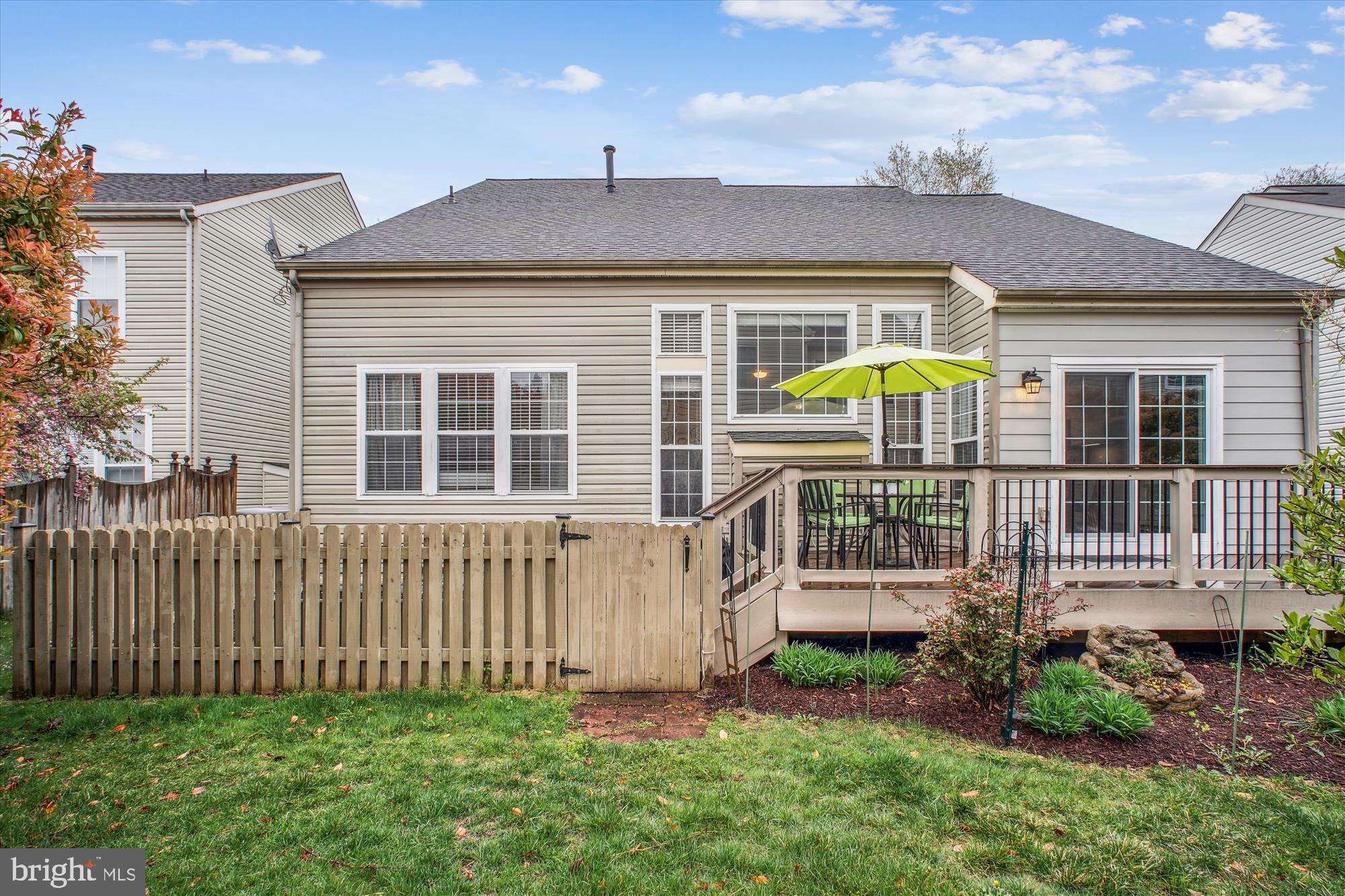 2454 Arctic Fox Way Reston, VA 20191 - Photo 3 of 54 a front view of a house with a garden and plants