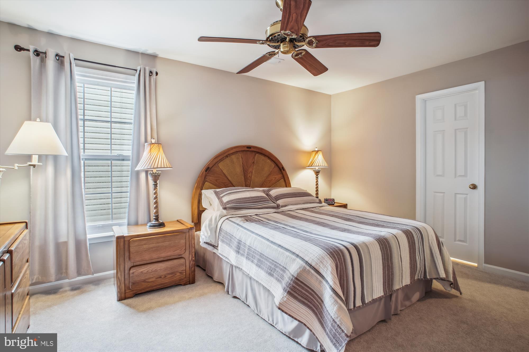 2454 Arctic Fox Way Reston, VA 20191 - Photo 32 of 54 a bedroom with a bed and a chandelier