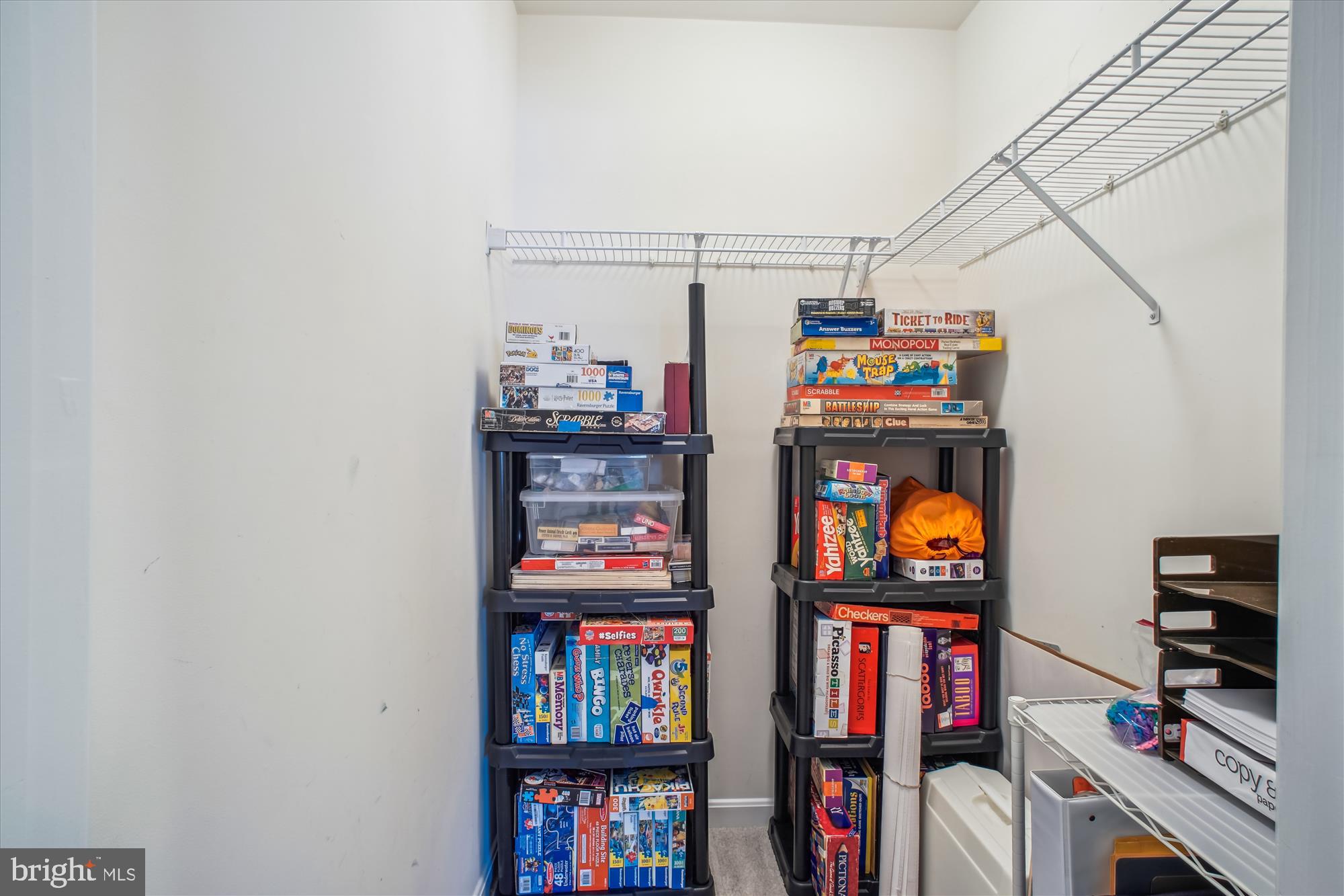 2454 Arctic Fox Way Reston, VA 20191 - Photo 33 of 54 a shelf with books and knick knacks on it