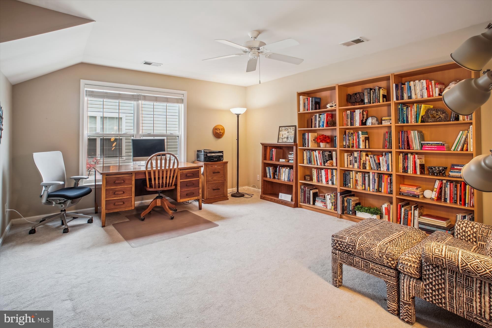 2454 Arctic Fox Way Reston, VA 20191 - Photo 34 of 54 a living room with furniture gym equipment and a book shelf