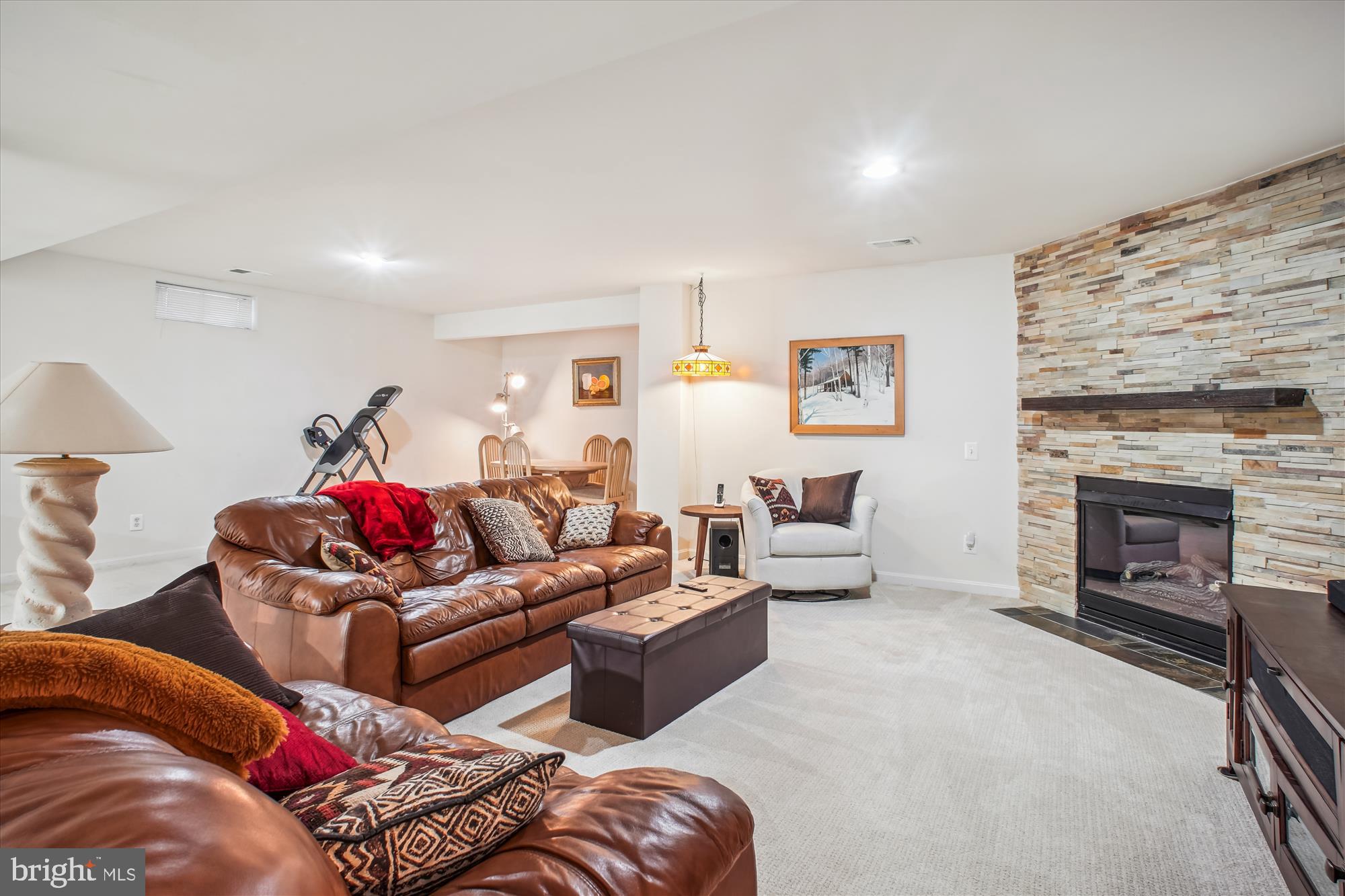 2454 Arctic Fox Way Reston, VA 20191 - Photo 36 of 54 a living room with furniture and a fireplace