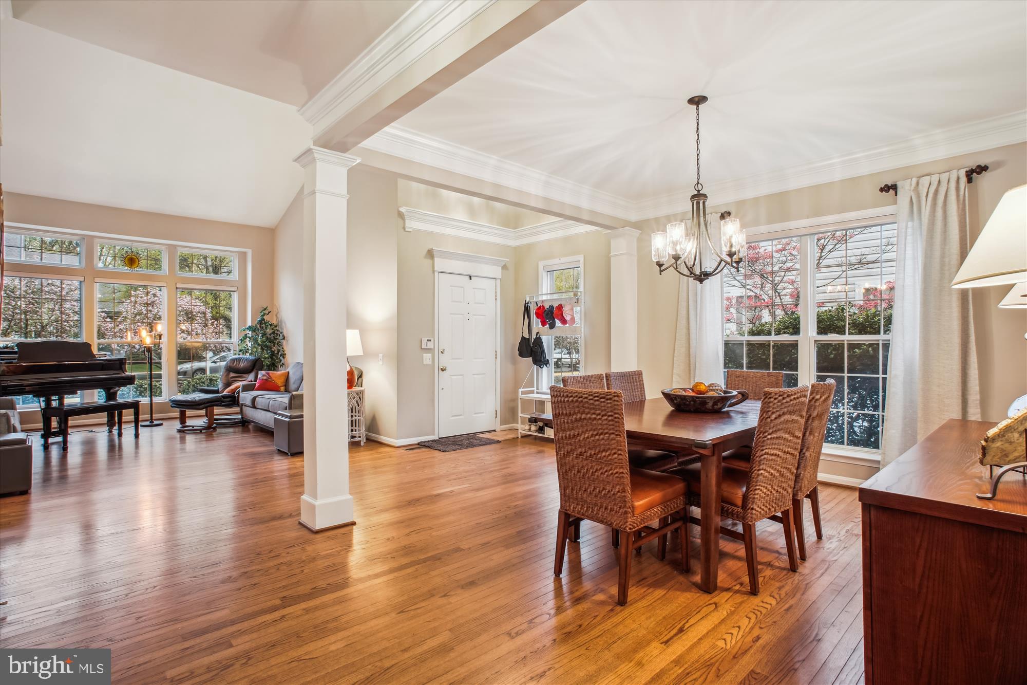 2454 Arctic Fox Way Reston, VA 20191 - Photo 4 of 54 a view of a dining room and livingroom with furniture wooden floor a chandelier