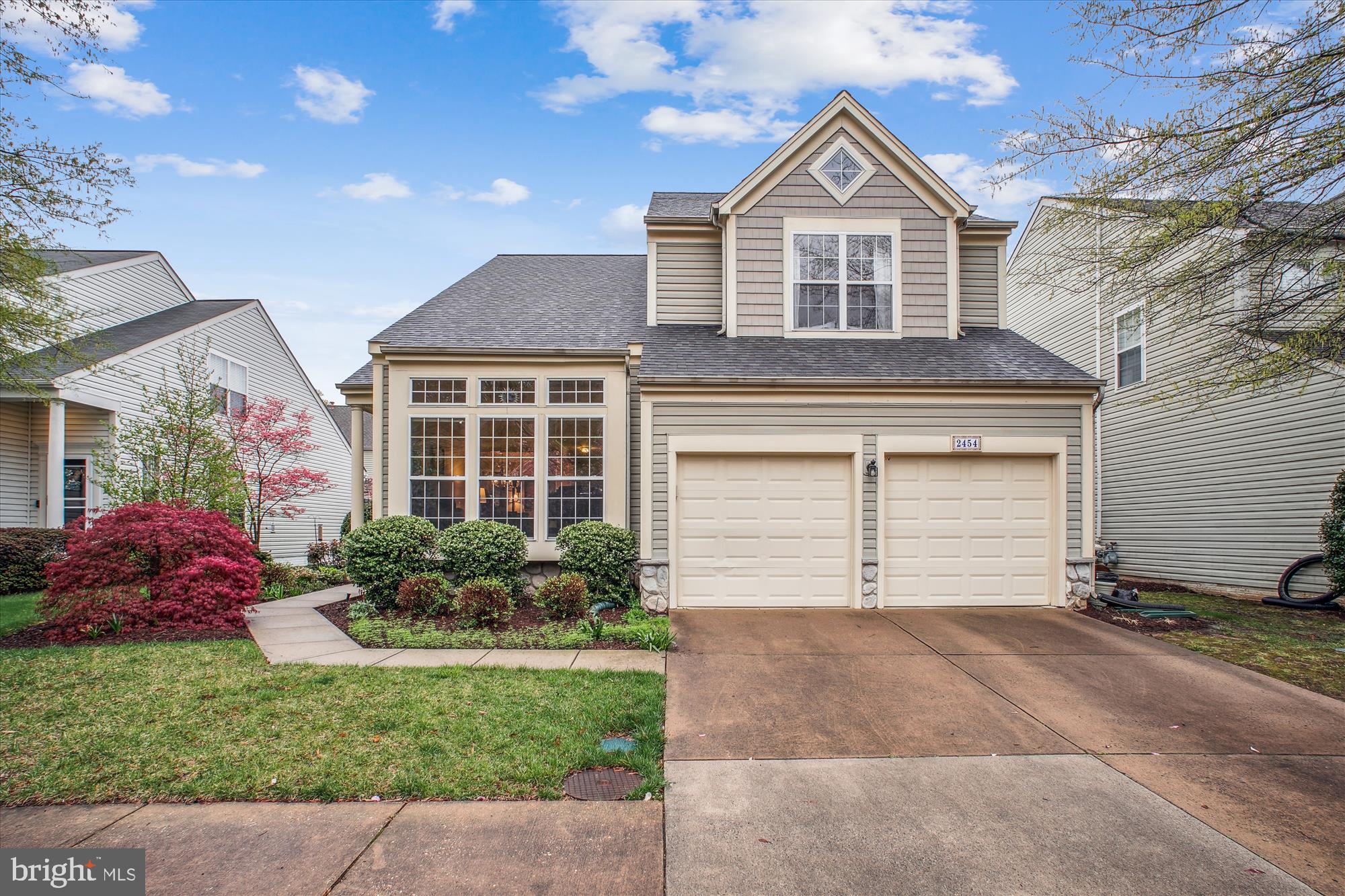 2454 Arctic Fox Way Reston, VA 20191 - Photo 45 of 54 a front view of a house with a yard and garage