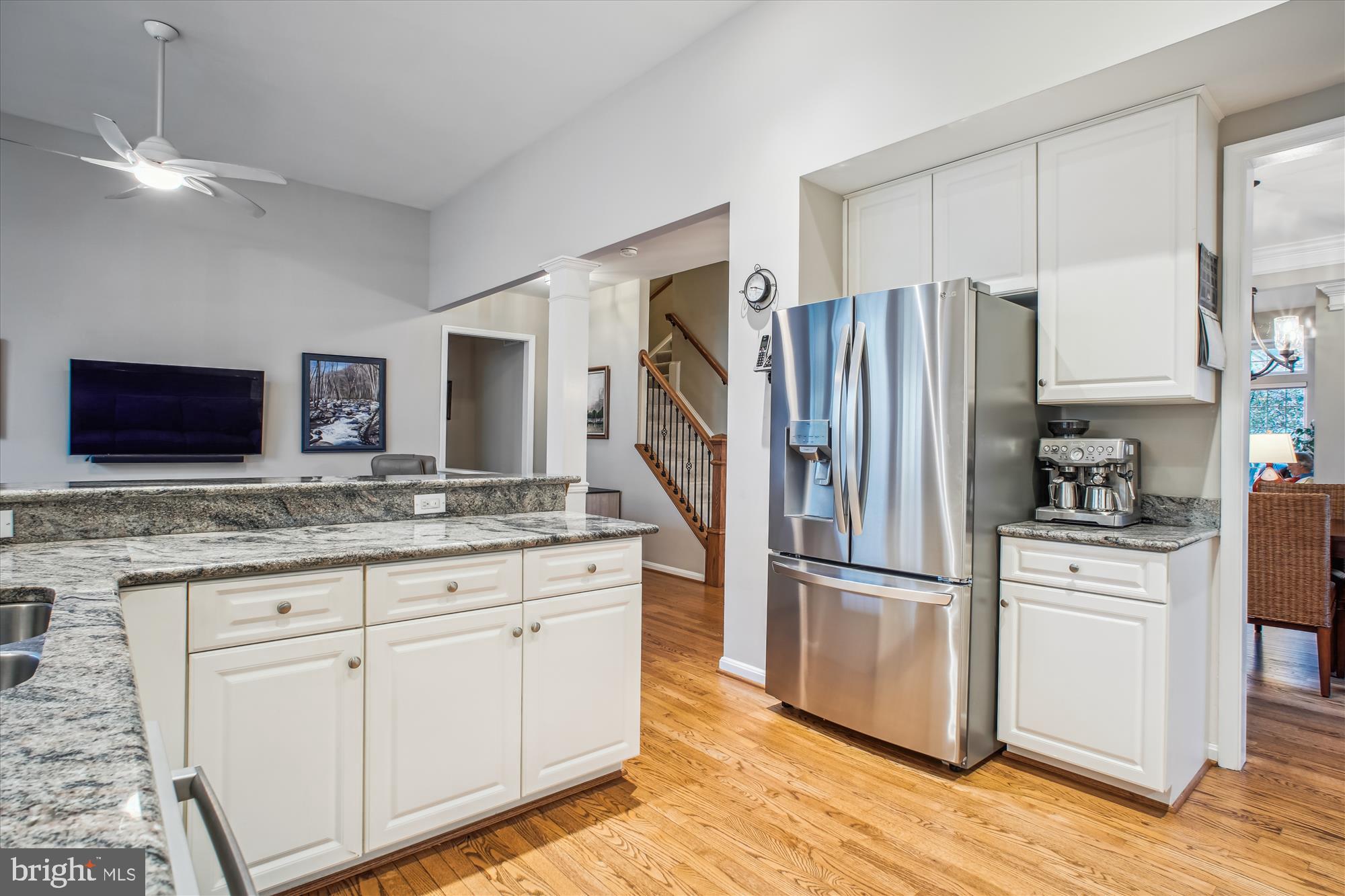 2454 Arctic Fox Way Reston, VA 20191 - Photo 6 of 54 a kitchen with stainless steel appliances granite countertop a refrigerator and a stove top oven