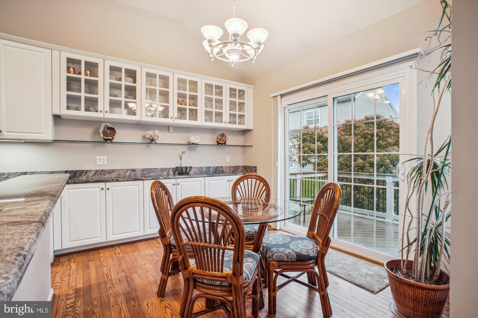 2454 Arctic Fox Way Reston, VA 20191 - Photo 10 of 54 a dining room with furniture potted plants and wooden floor