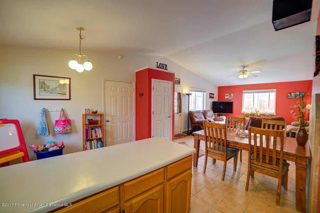 815 Whiteriver Avenue Rifle, CO 81650 - Photo 7 of 15 a view of a dining room with furniture and chandelier