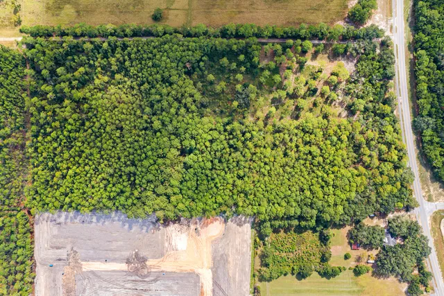 a view of a street with a yard