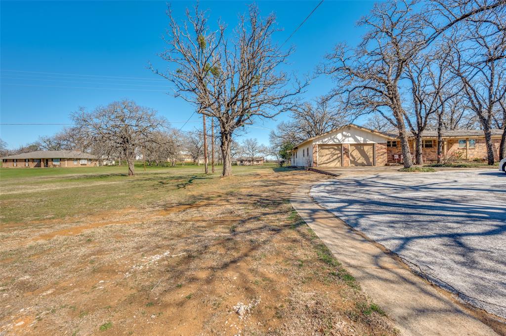 1251 Johnson Road Keller, TX 76248 - Photo 5 of 11 View of yard featuring gravel driveway