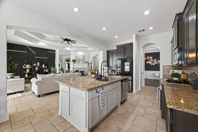 a view of a kitchen with furniture and a kitchen