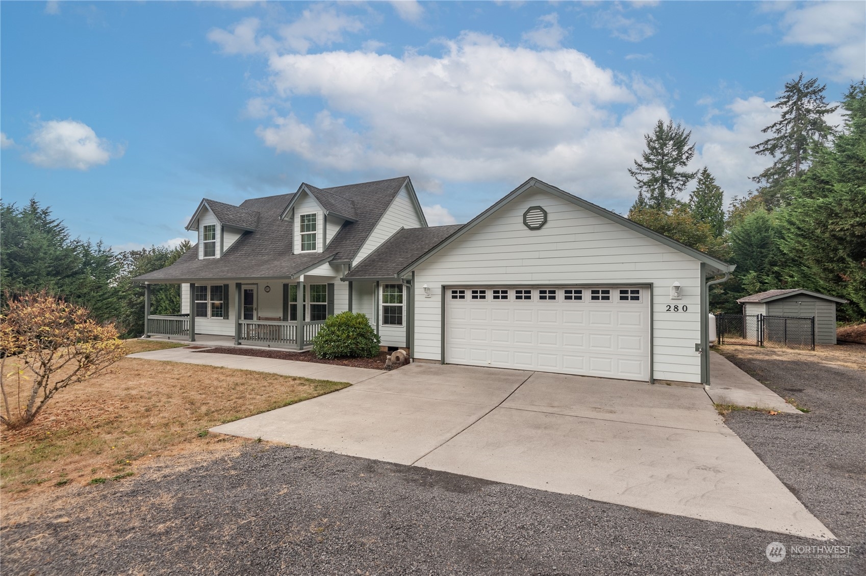 280 Niemi Road Longview, WA 98632 - Photo 2 of 24 a front view of a house with a yard and garage