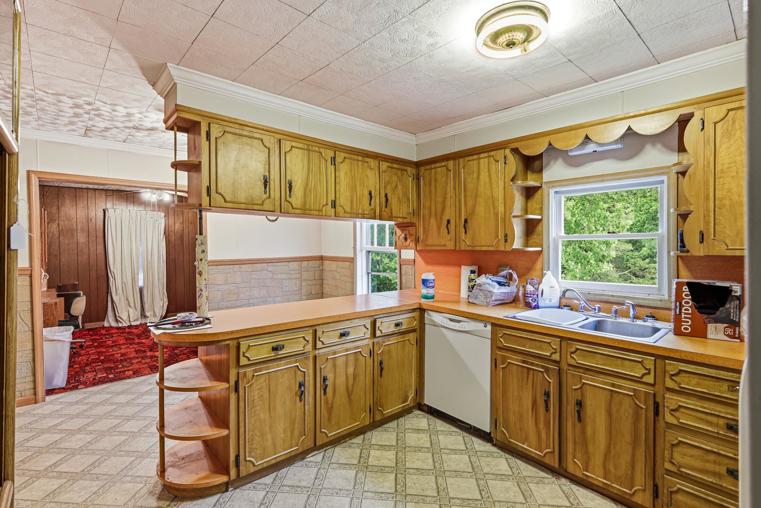 13896 Rockingham Pike Elkton, VA 22827 - Photo 23 of 60 a kitchen with a sink stove and cabinets