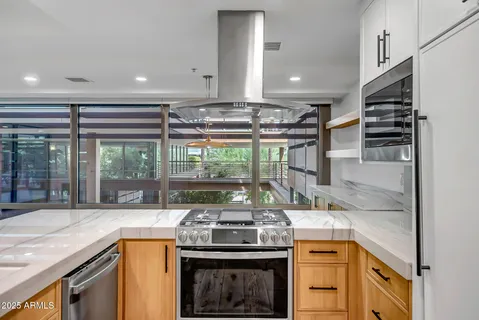 a kitchen with a stove and a sink