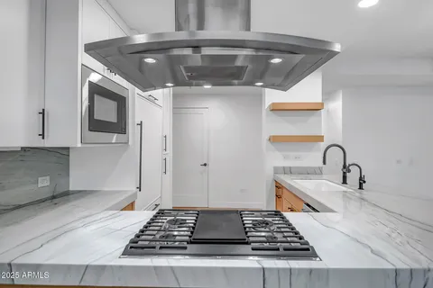 a kitchen with a stove and a sink