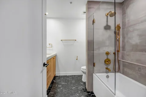 a bathroom with a bathtub and a shower