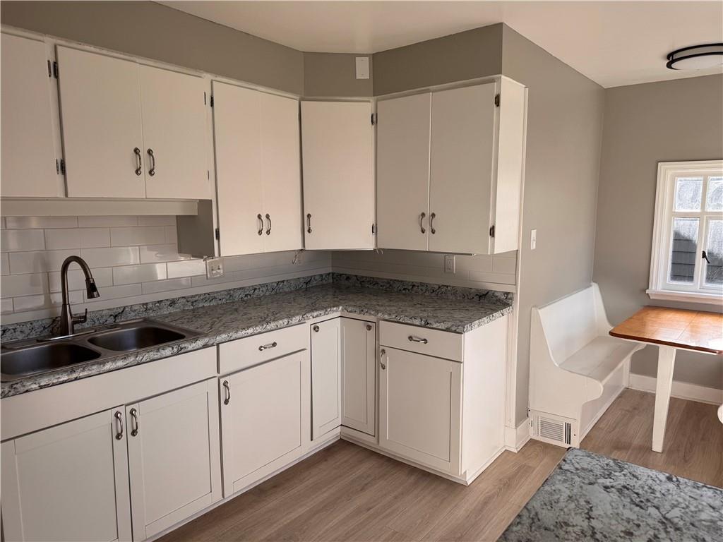 809 Linden Street Sharon, PA 16146 - Photo 7 of 17 a view of a kitchen with granite countertop cabinets