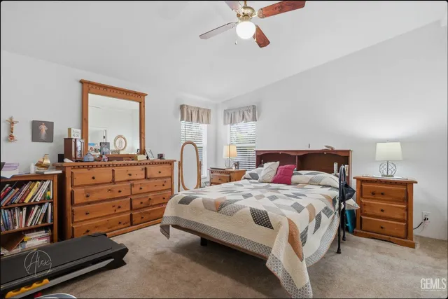 a bedroom with a bed and a dresser