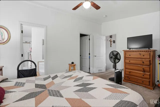 a bedroom with a bed and a dresser