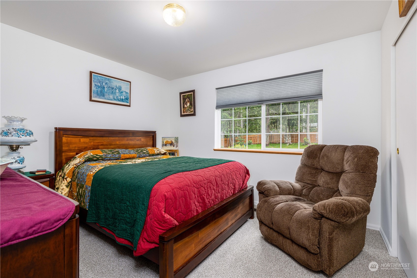 80 East Dunvegan Road Shelton, WA 98584 - Photo 11 of 24 a bedroom with a bed and a couch with window